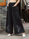  Dark wash straight jeans for women with floral embroidery on hem, desi Eid wear