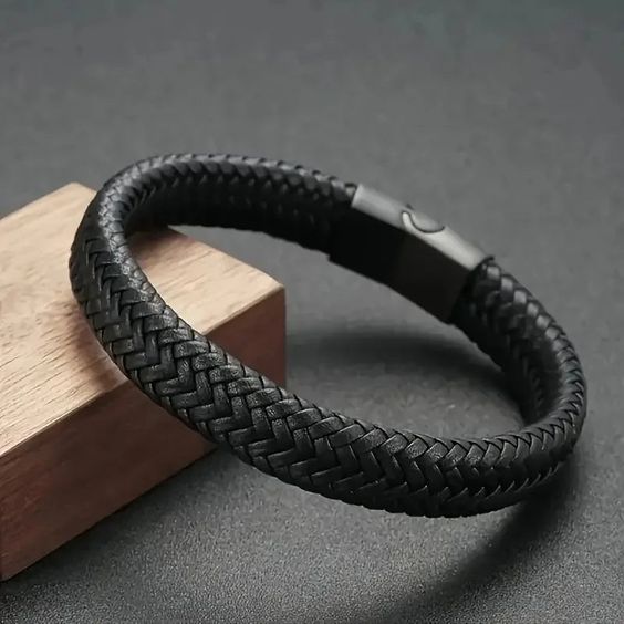 Black braided leather bracelet for men with magnetic steel clasp worn on wrist - Texora