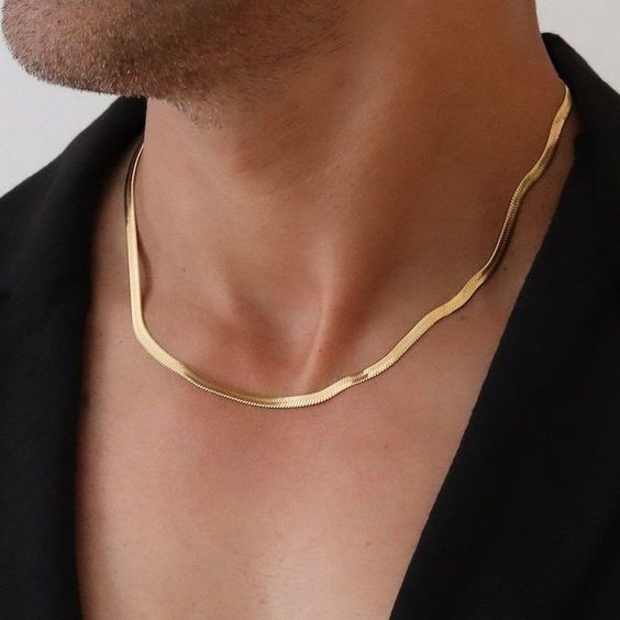 Men's black herringbone chain necklace flat lay on white background stainless steel