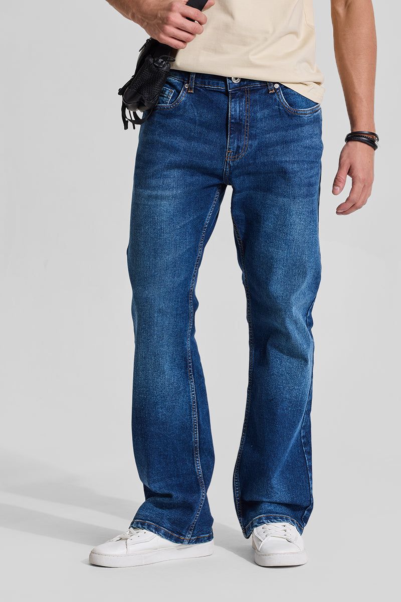 Dark indigo bootcut jeans for men with high rise flare, retro cowboy style button fly