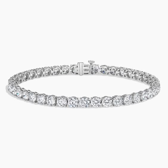 Woman's wrist wearing dainty silver CZ tennis bracelet