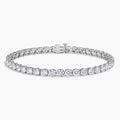 Woman's wrist wearing dainty silver CZ tennis bracelet