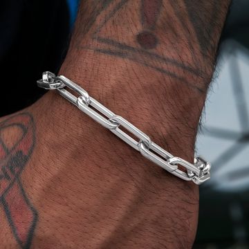 Silver paperclip link bracelet flat lay
