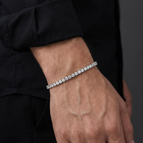 Gold tennis bracelet with cubic zirconia stones on male wrist