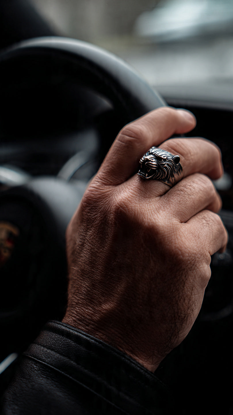 Men's matte black stainless steel signet ring with 3D embossed tiger head design on white background