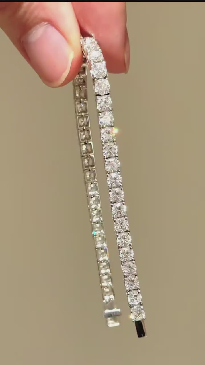 Gold tennis bracelet with cubic zirconia stones on male wrist