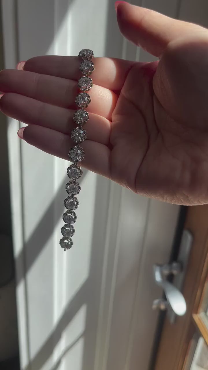 Woman's wrist wearing dainty silver CZ tennis bracelet